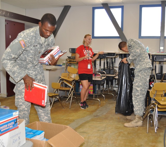Soldiers helping teacher
