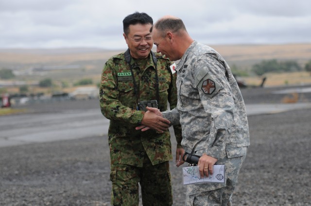 A Japanese Maj. Gen. gets an aerial tour of the Yakima Training Center, Wash.