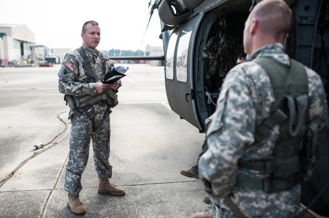 CWO2 Gilham does preflight safety brief