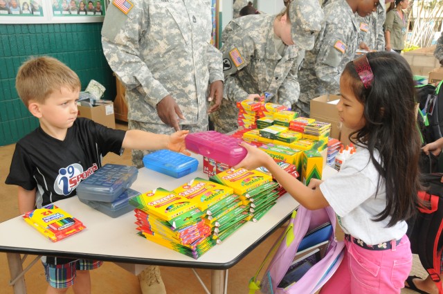 Students say thanks and exchange handshakes and hugs with the Soldiers on their way back to class, after visiting and taking photos with the Soldiers, Sep. 10.