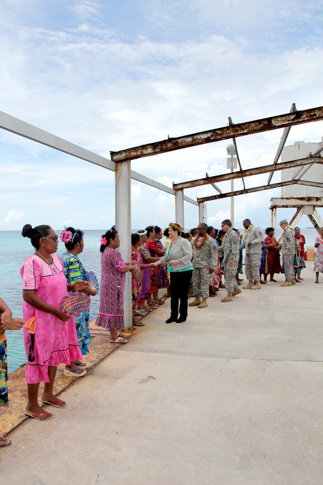 Katherine Hammack is greeted on Enniburr Island