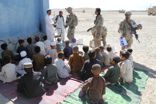 Vanguard infantrymen deliver school supplies to Afghan children