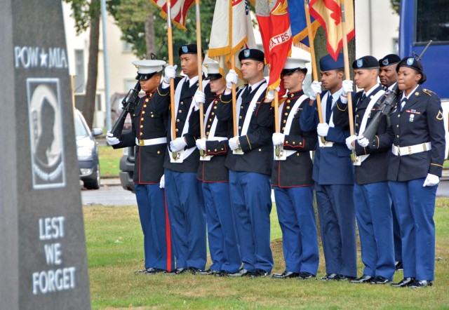 Community member pause to pay tribute on 9/11