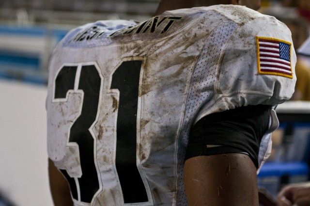 Army running back Terry Baggett's jersey tells a tale of pain
