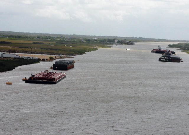 Barges on east Colorado River Locks anchor to mooring buoys