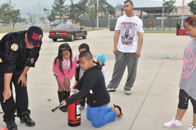 Children learn about fire safety at Fire Prevention event 