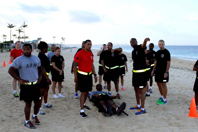 Headquarters and Headquarters Company, 10th Regional Support Group Soldiers enjoy a competitive day at the beach