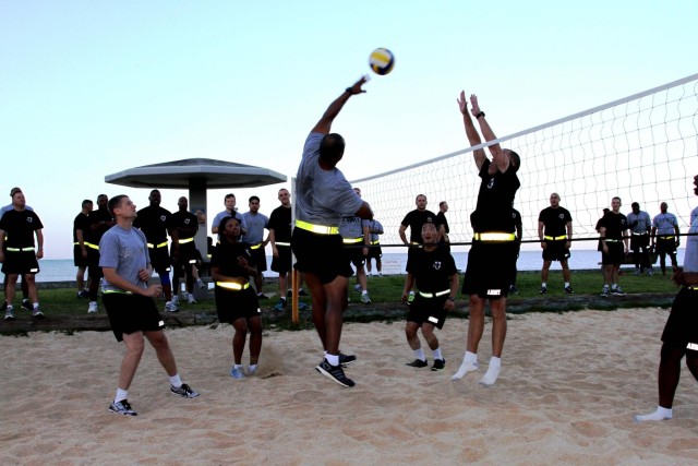 Headquarters and Headquarters Company, 10th Regional Support Group Soldiers enjoy a competitive day at the beach