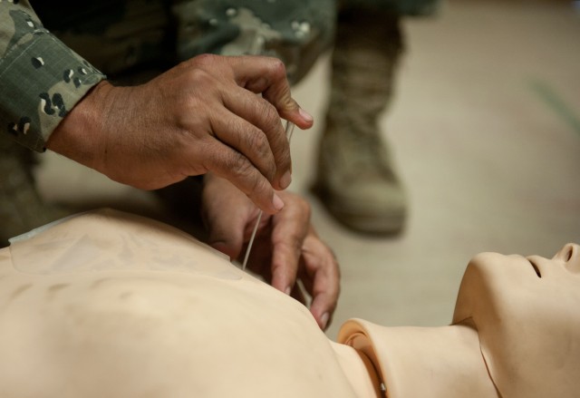 Training trainers: Afghan police lifesavers practice medical skills to teach to comrades
