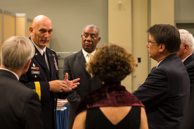 Army Chief of Staff Gen. Raymond T. Odierno speaks with the Governor of North Carolina Hon. Pat McCrory and his advisors at The Association of The United States Army (AUSA) Exposition 