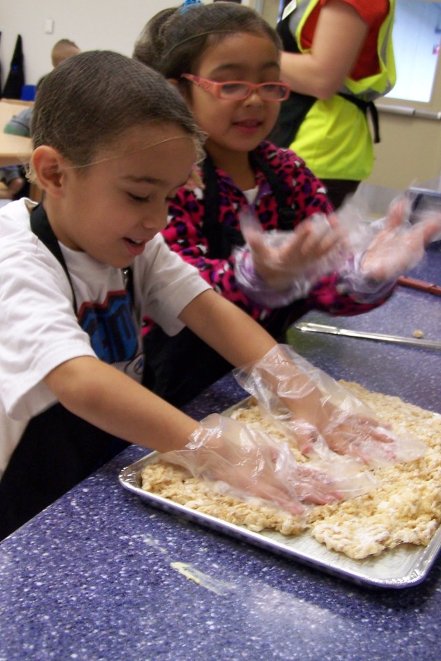 Spreading the treats on the baking sheet
