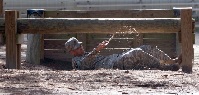 Sgt. 1st Class Ryan McCaffrey navigates through obstacles