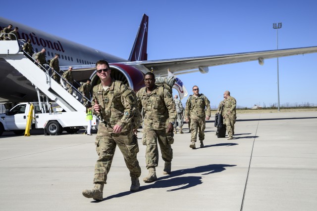 Members of the Wisconsin Army National Guard's Battery B, 1st Battalion, 121st Field Artillery arrive at Fort Bliss, Texas
