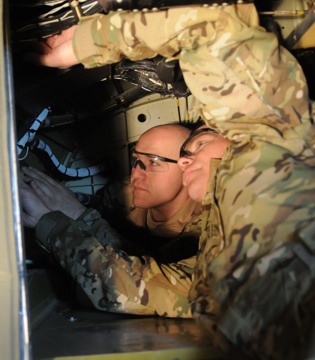 Specialized aviation maintainers repair damaged helicopter's electrical system in painstaking project