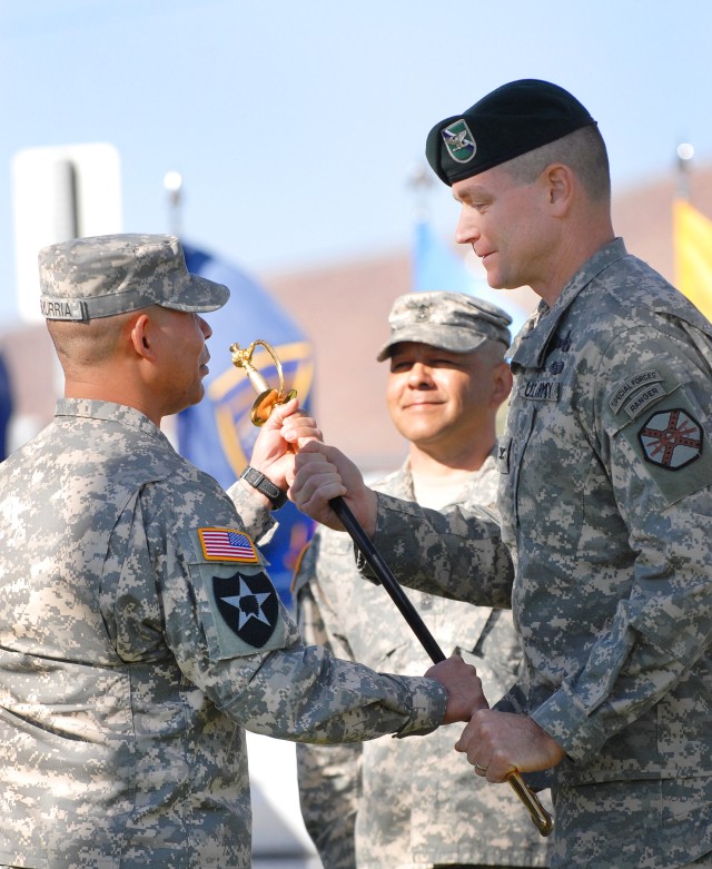 CSM Esmurria receives NCO sword from COL Braga