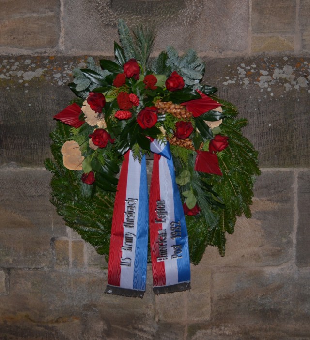 The wreath donated by American Legion, Post 1982, is placed on the wall