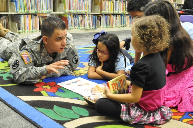 US Army Reserve soldier reads to children