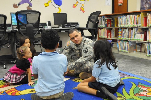 US Army Reserve soldier reads to children
