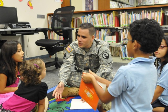 US Army Reserve soldier reads to children