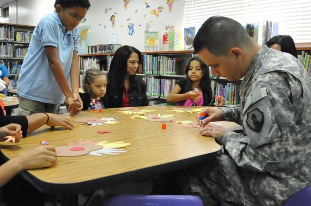 US Army Reserve soldier reads to children