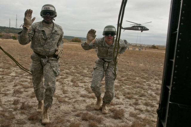 Air Assault School students approach Black Hawk for rappel testing
