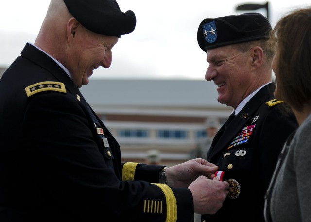 Gen. Cone pins Maj. Gen. May's Distinguished Service Medal