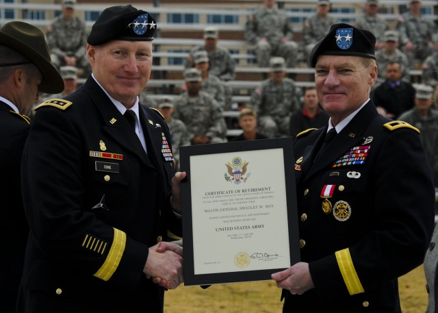 Gen. Cone presents certificate of retirement to Maj. Gen. May