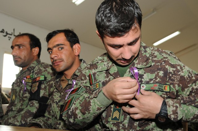 ANA wear purple ribbons, support elimination of violence against women