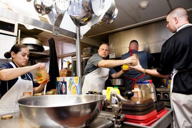 Retention team volunteers prepare dinner for local shelter