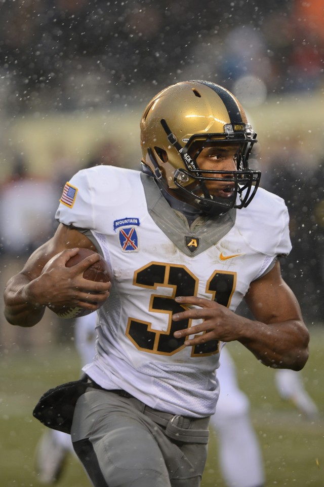 Navy drives past Army, 34-7, In snow-covered showdown