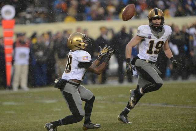 Navy drives past Army, 34-7, In snow-covered showdown