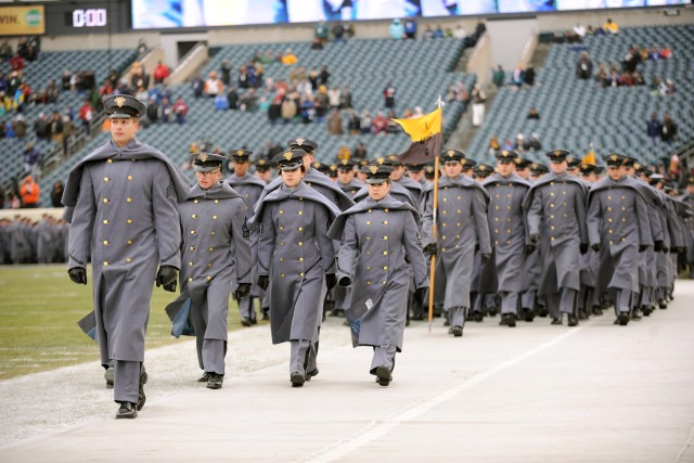 Navy drives past Army, 34-7, In snow-covered showdown