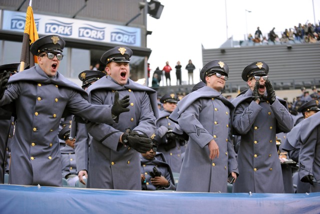 Navy drives past Army, 34-7, In snow-covered showdown