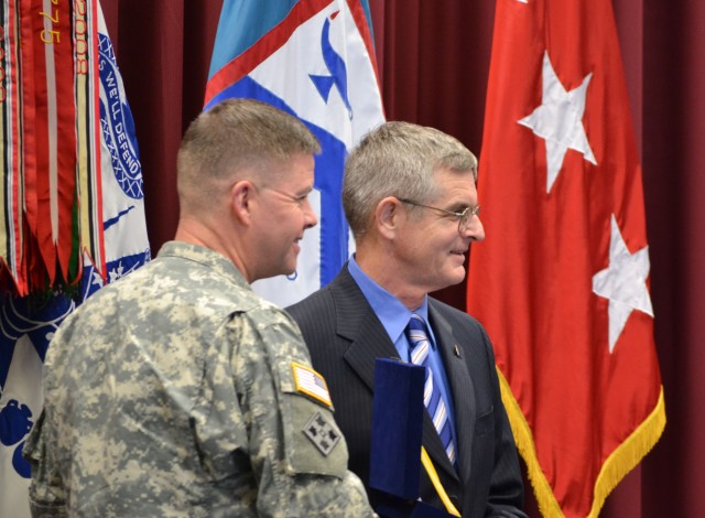 Lt. Gen. David G. Perkins presents the award to Ancker