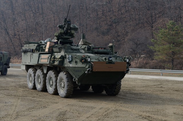 A M1135 Stryker NBCRV (Nuclear, Biological, Chemical, Reconnaissance Vehicle) with 23rd Chemical Battalion, 1st Armored Brigade Combat Team, 2nd Infantry Division, fires its Browning .50-caliber machi