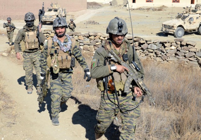 Afghan security forces discuss new checkpoint after clearing operation in Paktika