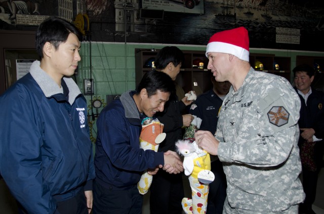 Santa Express delivers smiles, treats to Yongsan's unsung heroes