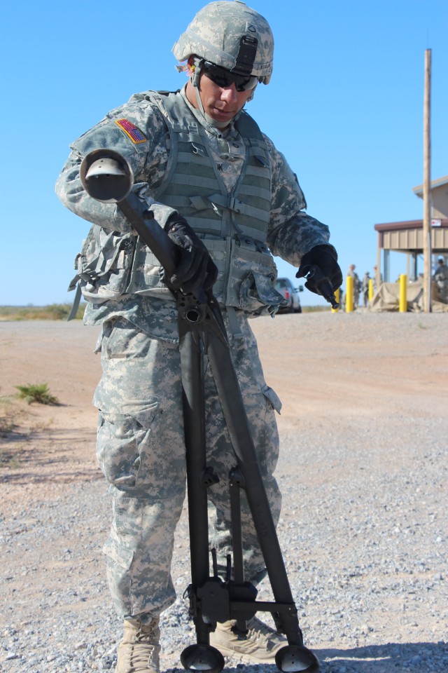 Soldier stows M205 tripod