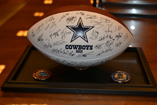 Football, coins presented to Staff Sgt. (ret) Bud Moore, WWII and Korean War Veteran