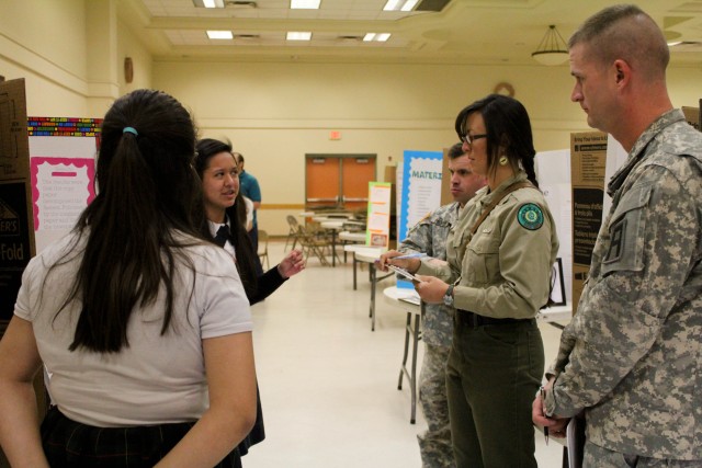 Army trainers judge fourth annual local science fair projects
