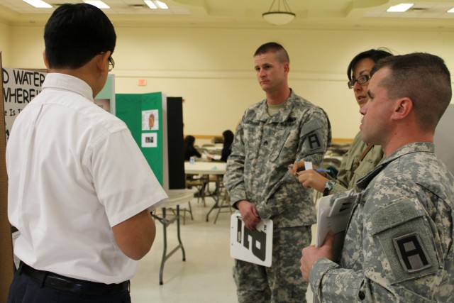 Army trainers judge fourth annual local science fair projects