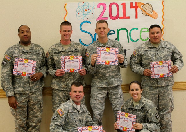 Army trainers judge fourth annual local science fair projects