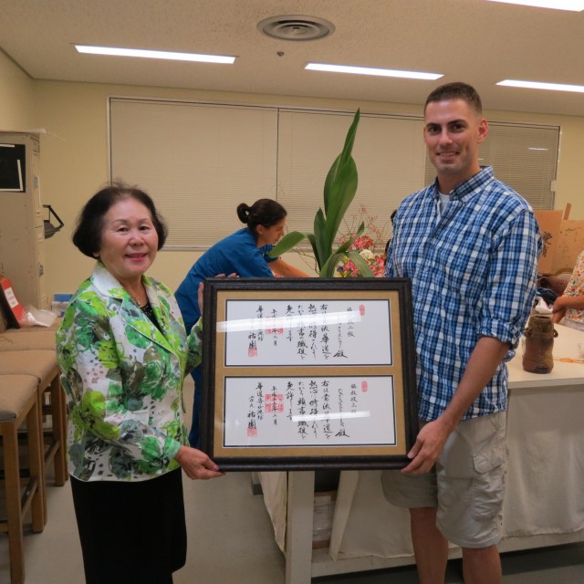 Capt. "Renoll-saince" Man embraces Ikebana