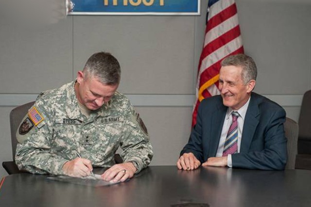 Maj. Gen. Dyess signs MOU for MITRE fellowship