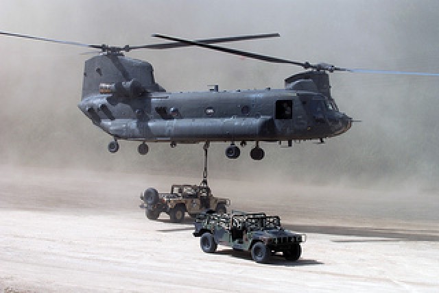 A CH-47 Chinook Helicopter is flown by pilots 