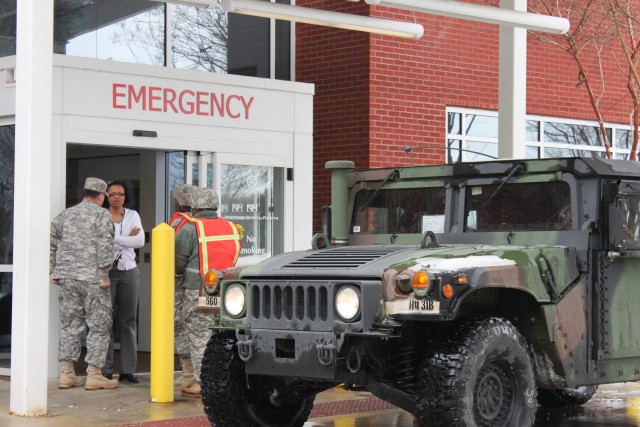 Guardsmen Transporting Healthcare Professionals