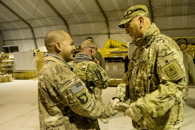 U.S. Army Chief of Staff, Gen. Ray Odierno and Coach Harbaugh visit troops in Afghanistan.