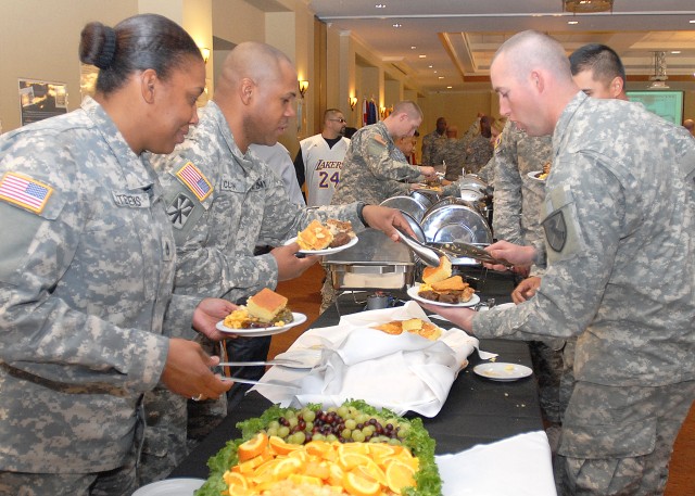 Soldiers enjoy food at the  Fort Irwin 2014 African American Black History Month Celebration