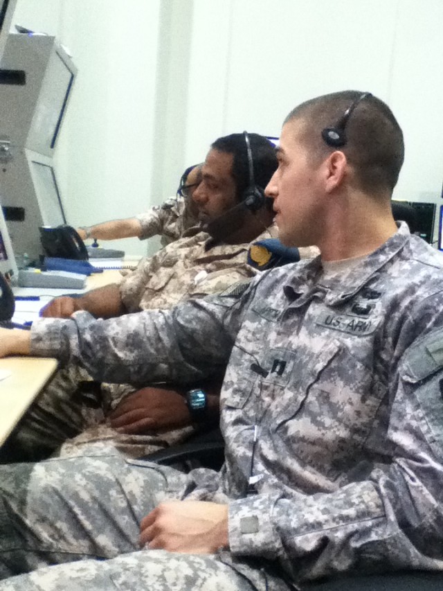 Capt Chase Pittman of 1-62 ADA operates as the U.S. Patriot Tactical Control Officer.  At his side Emirati Soldiers operate a simulated HAWK weapons system during an integrated air battle.