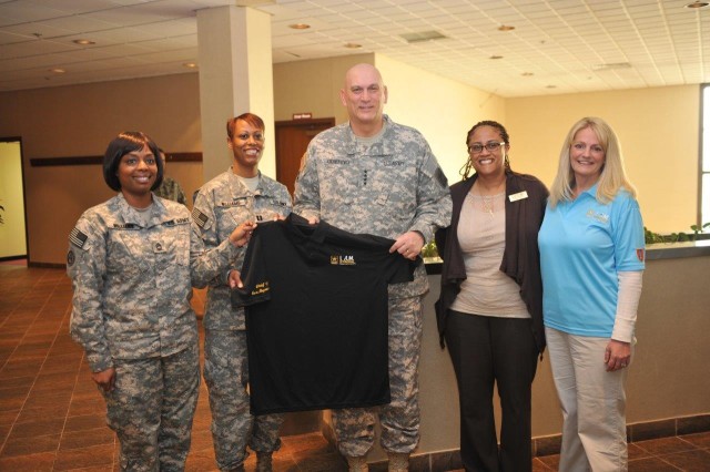 CSA presented with a personalized Army Strong SHARP polo shirt